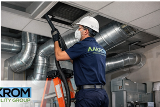 Aakrom technician servicing commercial HVAC system